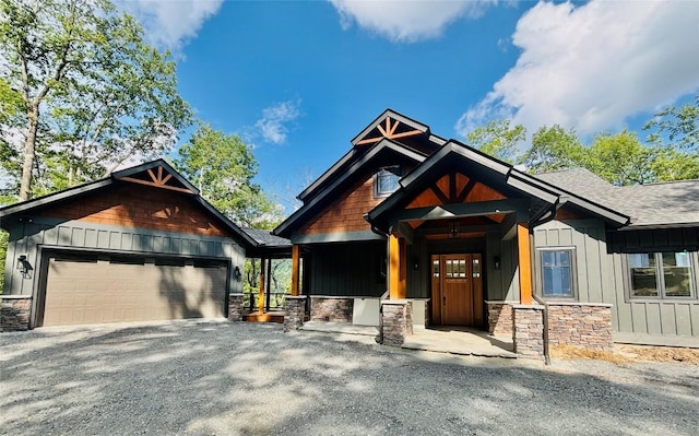 99 Sori Ln, Sapphire, NC 28774 - craftsman house with board and batten siding, stone siding, a shingled roof, and a garage