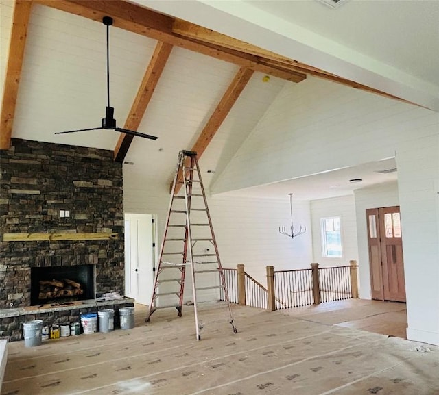 99 Sori Ln, Sapphire, NC 28774 - unfurnished living room with high vaulted ceiling, beam ceiling, and a fireplace