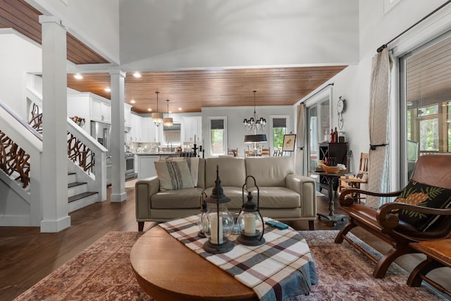 1582 New Settlers Way, Glenville, NC 28736 - living area featuring a chandelier, healthy amount of natural light, dark wood-style flooring, ornate columns, and wooden ceiling