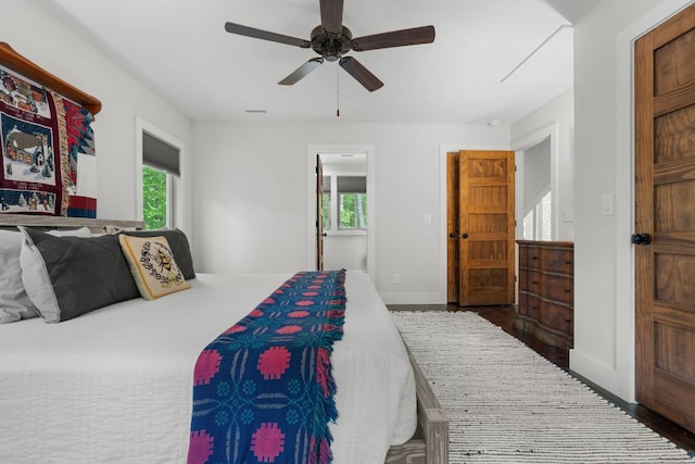 1582 New Settlers Way, Glenville, NC 28736 - bedroom with multiple windows, baseboards, and a ceiling fan