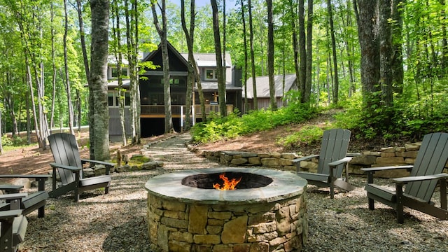 1582 New Settlers Way, Glenville, NC 28736 - view of patio / terrace with a fire pit and a sunroom