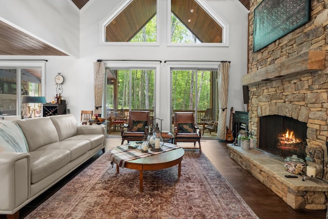 1582 New Settlers Way, Glenville, NC 28736 - living room featuring a high ceiling, healthy amount of natural light, wood finished floors, and a stone fireplace