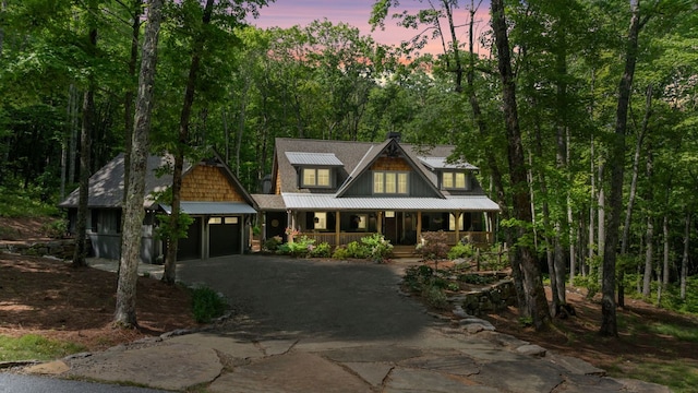 1582 New Settlers Way, Glenville, NC 28736 - view of front of house with covered porch, driveway, and a garage