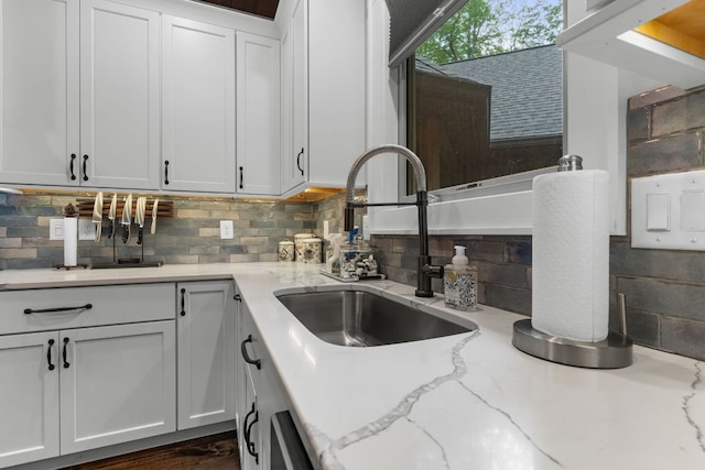 1582 New Settlers Way, Glenville, NC 28736 - kitchen featuring a sink, decorative backsplash, white cabinetry, and light stone counters