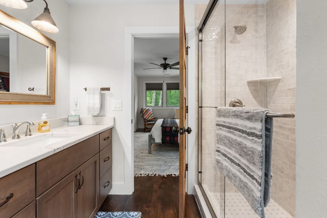 1582 New Settlers Way, Glenville, NC 28736 - ensuite bathroom featuring wood finished floors, vanity, a stall shower, and ceiling fan
