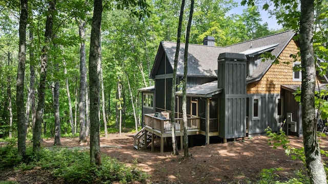 1582 New Settlers Way, Glenville, NC 28736 - back of house featuring a shingled roof, a wooden deck, a chimney, and board and batten siding