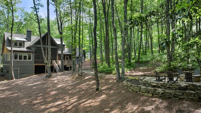 1582 New Settlers Way, Glenville, NC 28736 - back of property featuring a chimney, stairway, and a sunroom