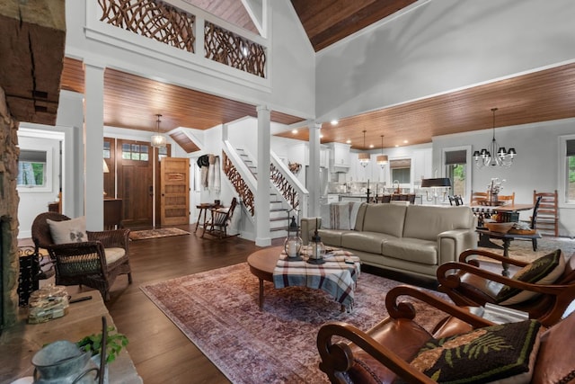1582 New Settlers Way, Glenville, NC 28736 - living room featuring wooden ceiling, decorative columns, dark wood finished floors, a chandelier, and a towering ceiling