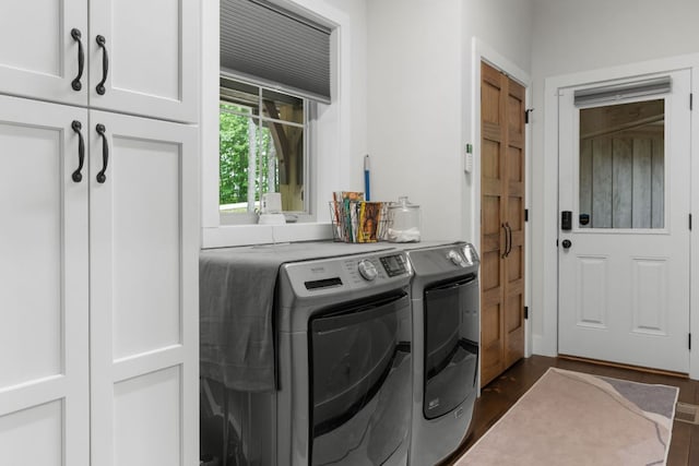 1582 New Settlers Way, Glenville, NC 28736 - laundry area featuring washing machine and clothes dryer, cabinet space, and dark wood-type flooring