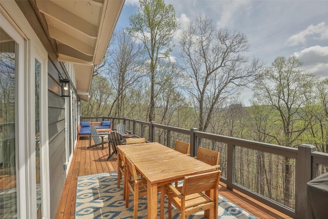 deck featuring outdoor dining area and an outdoor hangout area