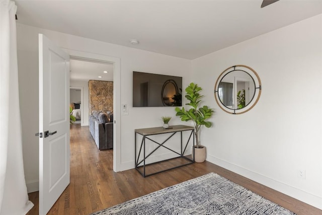 interior space with recessed lighting, baseboards, and wood finished floors