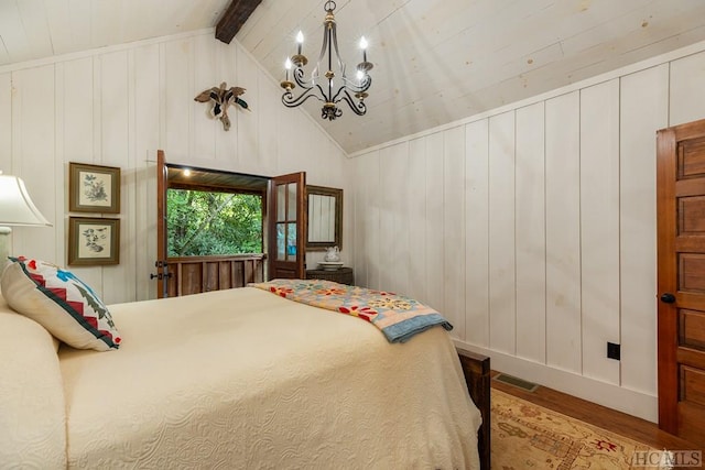 bedroom featuring vaulted ceiling with beams, a notable chandelier, wood-type flooring, and wooden walls