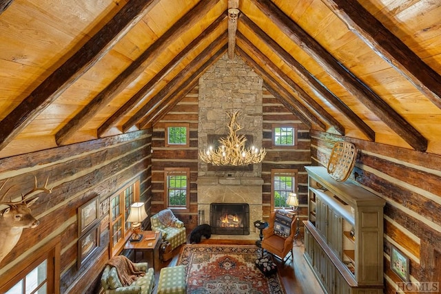 unfurnished living room with vaulted ceiling with beams, an inviting chandelier, wooden ceiling, a fireplace, and hardwood / wood-style floors