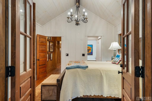 bedroom featuring lofted ceiling, a chandelier, wood ceiling, and wooden walls