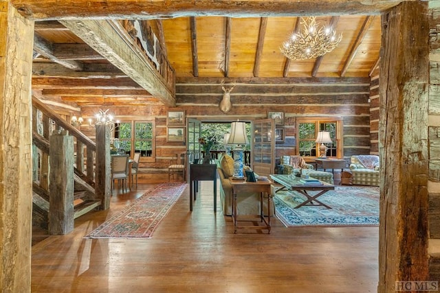 interior space featuring wood ceiling, beam ceiling, and a notable chandelier