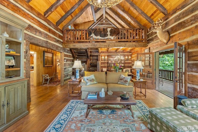 living room featuring hardwood / wood-style floors, beam ceiling, high vaulted ceiling, and wooden ceiling