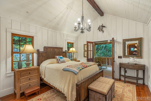 bedroom with vaulted ceiling with beams, hardwood / wood-style floors, and a notable chandelier