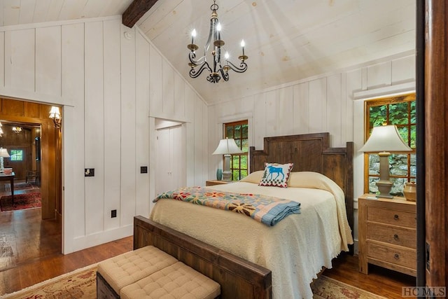 bedroom featuring vaulted ceiling with beams, dark wood-type flooring, wooden walls, and a chandelier