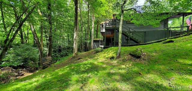 view of yard with a wooden deck