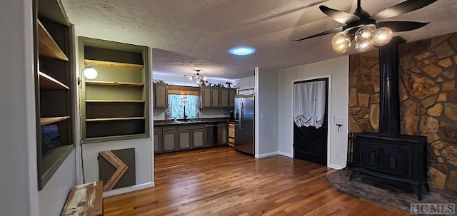 kitchen with dishwashing machine, a textured ceiling, stainless steel refrigerator with ice dispenser, sink, and dark hardwood / wood-style floors