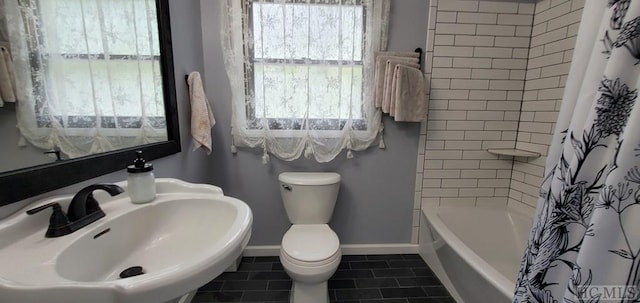 full bathroom with sink, toilet, shower / bathtub combination with curtain, and tile patterned flooring