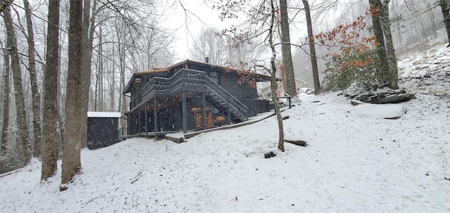 view of snow covered house