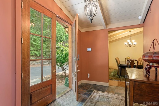 doorway to outside with wood ceiling, vaulted ceiling with beams, a notable chandelier, and a healthy amount of sunlight