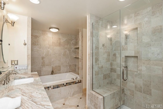 bathroom with tile patterned flooring, vanity, and independent shower and bath