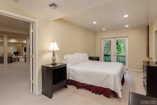 carpeted bedroom with access to outside and french doors