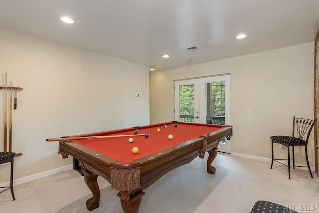 rec room featuring light carpet, pool table, and french doors