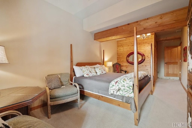 carpeted bedroom with wood walls