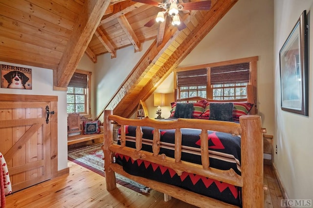 bedroom featuring vaulted ceiling with beams, wooden ceiling, ceiling fan, and light hardwood / wood-style floors