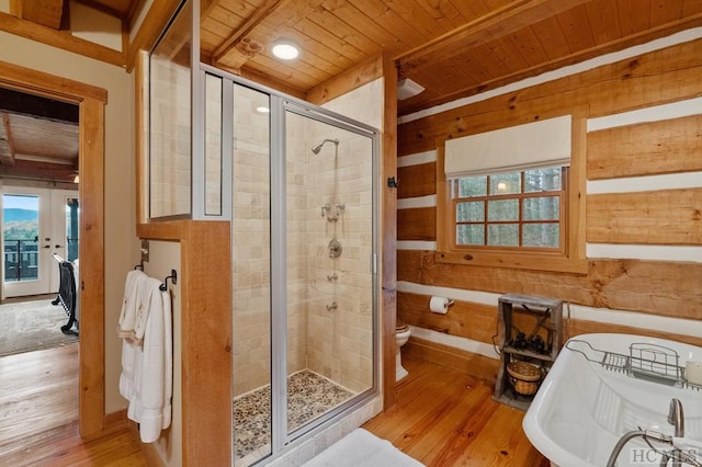 bathroom with an enclosed shower, wood-type flooring, wooden ceiling, and toilet