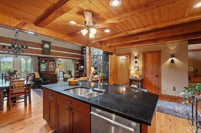 kitchen featuring sink, light hardwood / wood-style flooring, dishwasher, dark stone countertops, and beamed ceiling