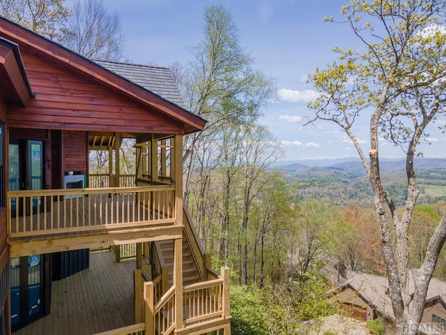 wooden terrace with a mountain view