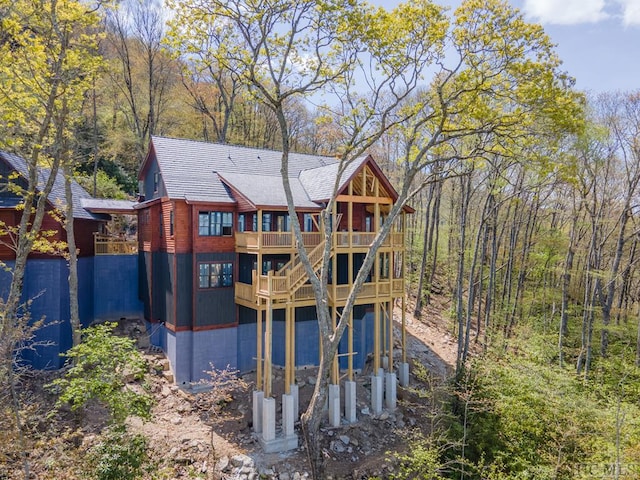 back of house with a balcony