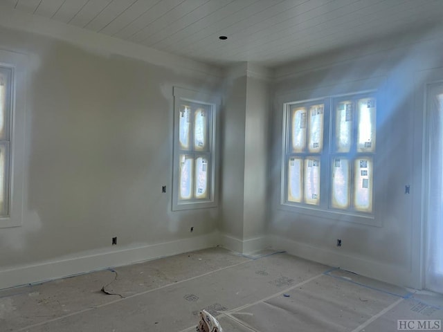 unfurnished room featuring wooden ceiling