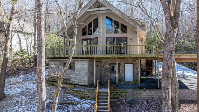 back of house featuring a wooden deck