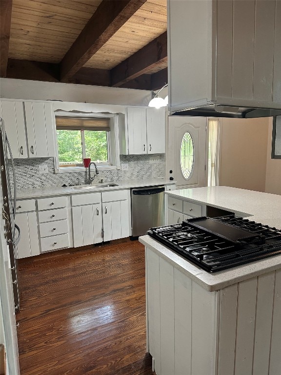 181 Hiwassee Rd, Lake Toxaway, NC 28747 - kitchen with stainless steel dishwasher, black gas cooktop, light countertops, white cabinets, and a wood ceiling with exposed beams