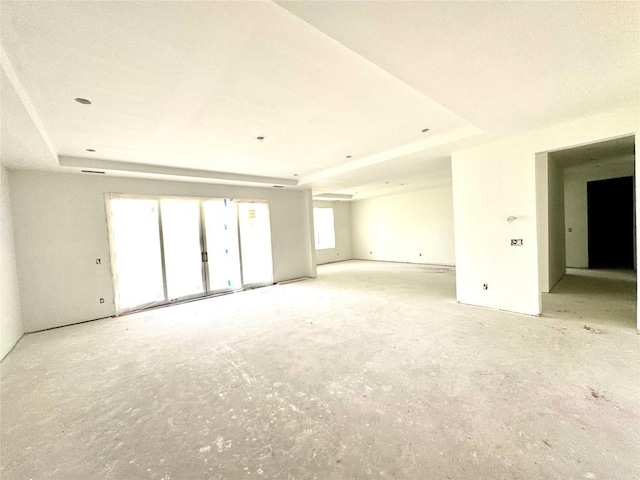 empty room featuring a raised ceiling