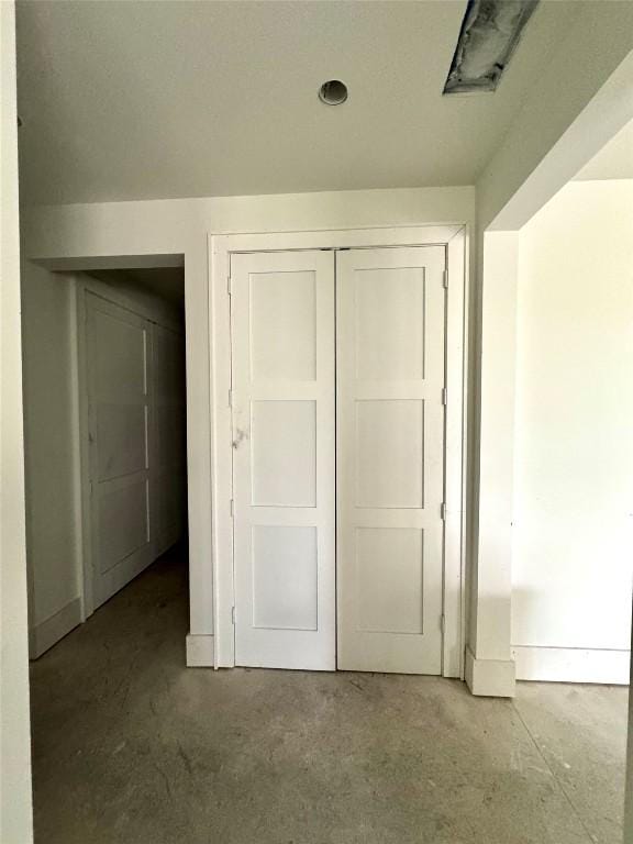 2385 Magnolia Dr, Highlands, NC 28741 - unfurnished bedroom with unfinished concrete floors and a closet