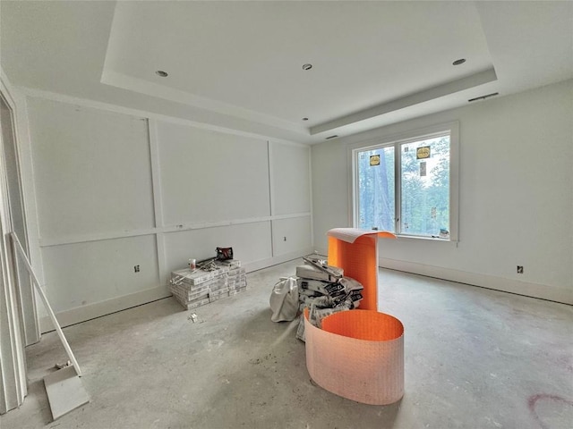 2385 Magnolia Dr, Highlands, NC 28741 - living room featuring a raised ceiling and unfinished concrete flooring
