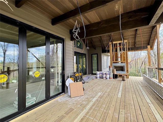 deck featuring an outdoor fireplace