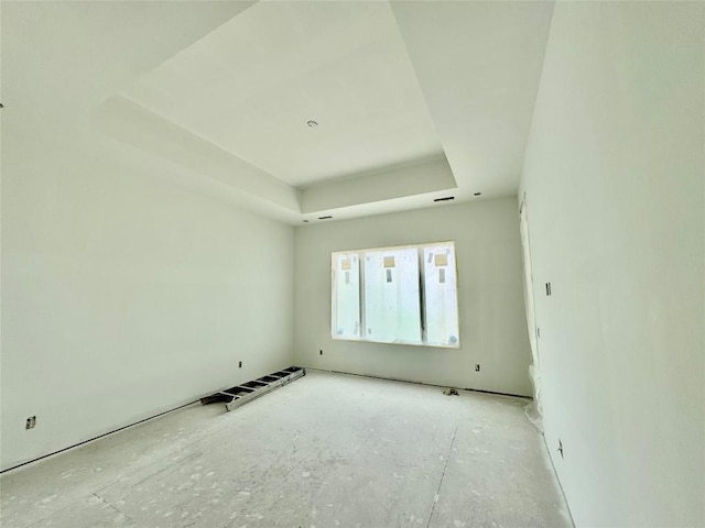 empty room with a raised ceiling