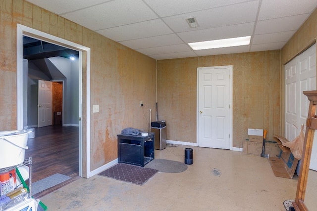interior space with a drop ceiling