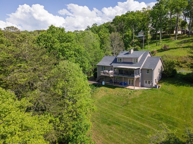 view from above of property featuring a forest