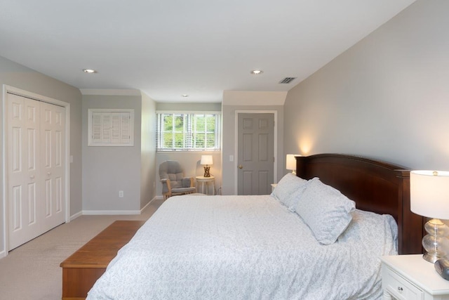 bedroom with light carpet, baseboards, recessed lighting, and a closet