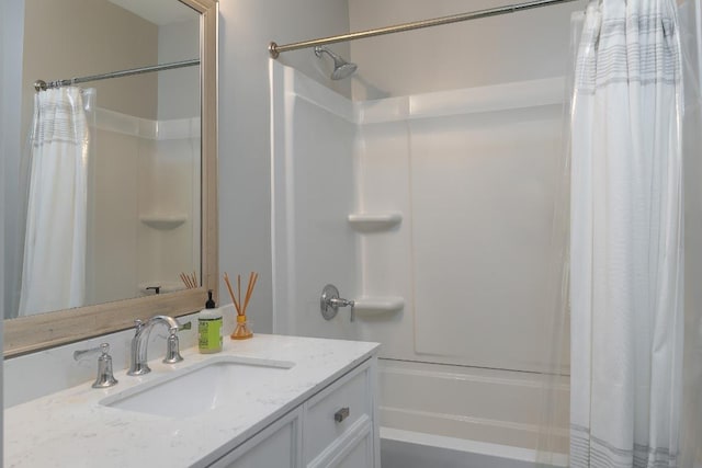 bathroom featuring vanity and shower / tub combo