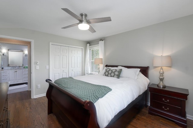 bedroom featuring a closet, dark wood-style floors, ceiling fan, and baseboards