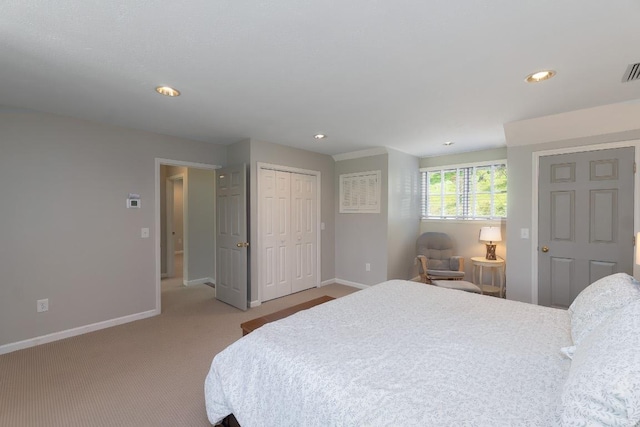 bedroom featuring baseboards, light carpet, recessed lighting, and a closet